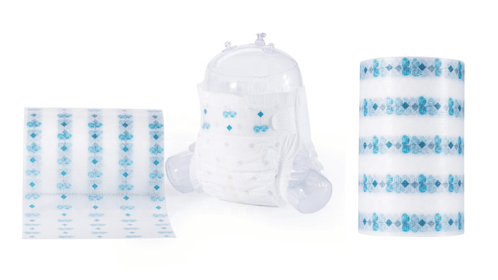 A photograph of a finished roll of PP frontal tape for baby diaper, placed on a workbench in a quality control lab to highlight its role in high-speed production.
