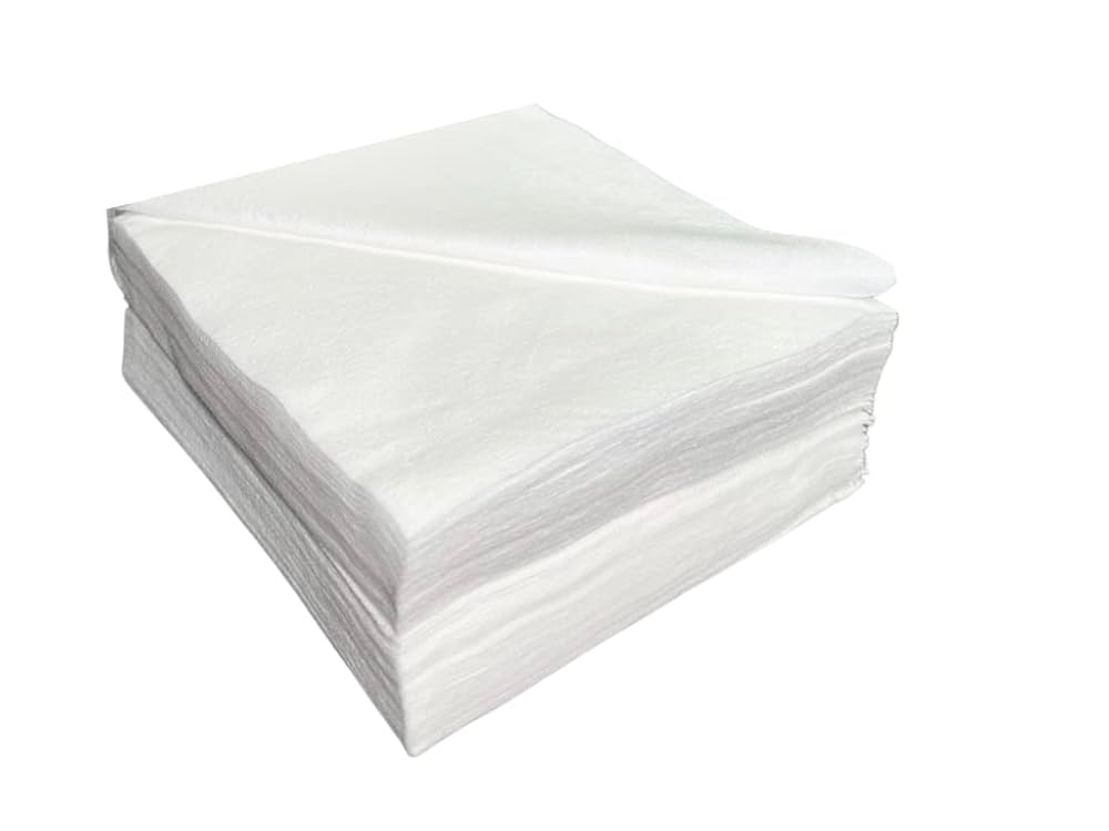 A pristine close-up shot of a stack of medical-grade dry wipes material, emphasizing its soft, absorbent texture ideal for sensitive skin and critical cleaning applications.