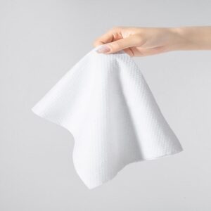 A close-up shot of a single wipe from the Embossed Parallel Lapping Spunlace Nonwoven Fabric product line, clearly showing the textured embossed pattern and the subtle parallel fiber alignment.