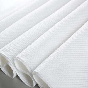 A close-up of the textured surface of Embossed Spunlace Non Woven Fabric, highlighting its unique diamond pattern for enhanced absorbency.