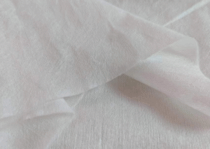 A close-up shot of a single wipe from the Pet Viscose Spunlace Nonwoven Fabric product line, clearly showing the material's softness and quality.