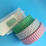 Cross-section view of a sanitary napkin showing the integrated Nano-silver chip for sanitary napkins acting as a moisture control chip.