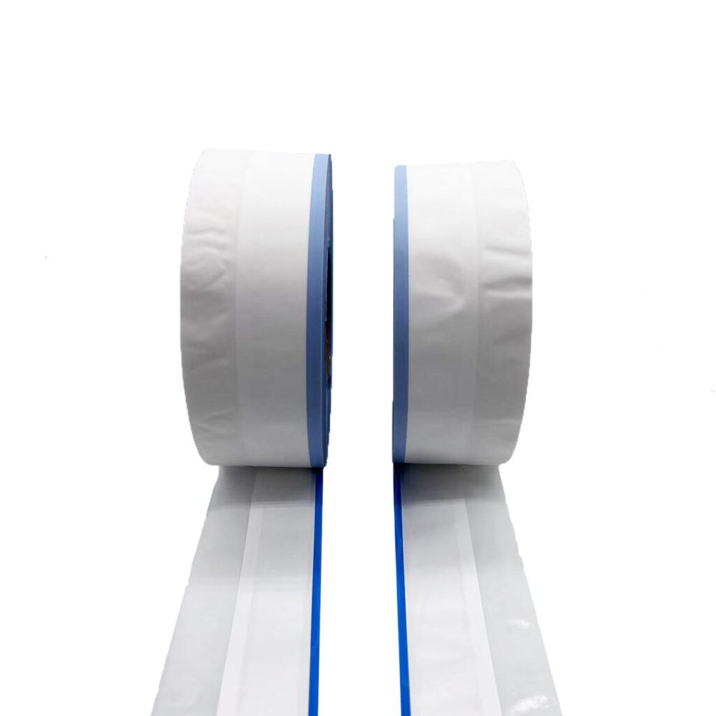 High-magnification view of rigid, extruded hooks on a roll of mechanical hook tape, showcasing the high-strength texture used for secure diaper fastening.