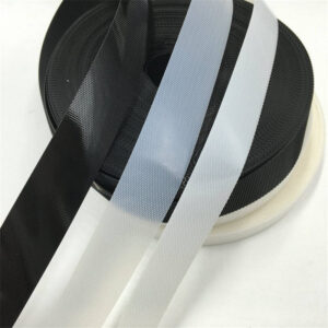 Palletized hook and loop magic side tape in jumbo roll tape format, demonstrating the bulk supply of diaper manufacturing component.