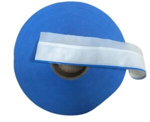 Close-up view of the high-tack adhesive and texture of the polypropylene side tape diaper.