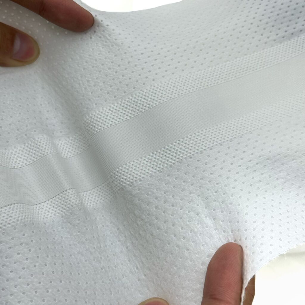Close-up image highlighting the ergonomic S-cut shape of the magic tape, illustrating the high-quality s cut magic tape for diaper fastening produced by Favourite Fab.