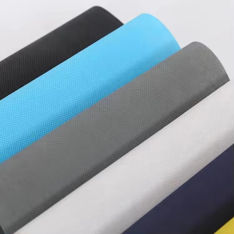 A magnified image of premium soft embossed spunbond nonwoven fabric, showcasing the gentle, velvety texture and pattern designed for enhanced user comfort.