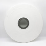 Macro view of the Textured Nonwoven fabric, highlighting the pattern that facilitates superior scrubbing action and improved grip.