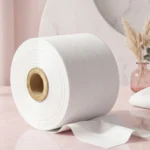 Premium spunlace nonwoven fabric with breathable texture used in sanitary napkin topsheets.